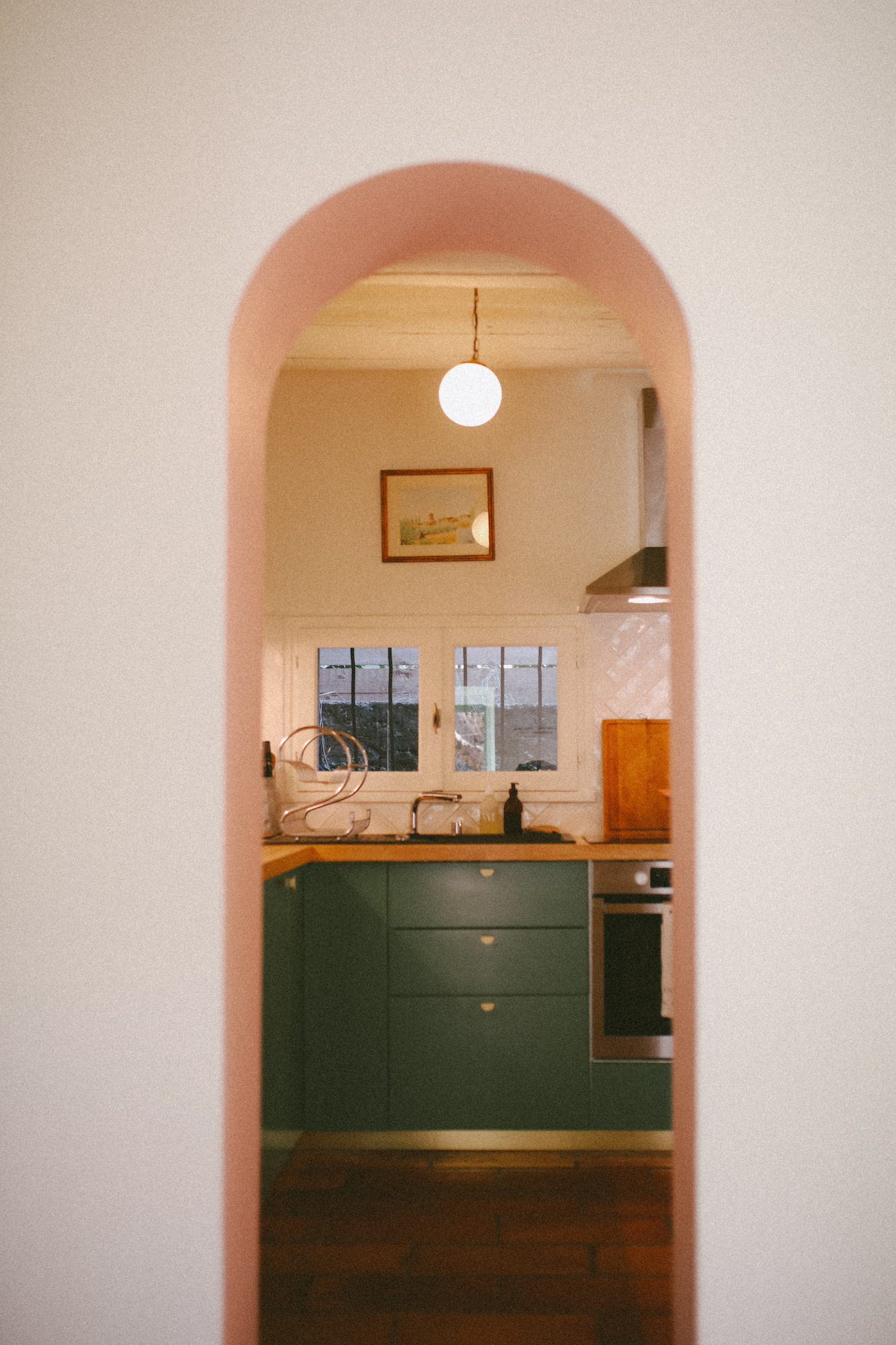 Pink archway kitchen